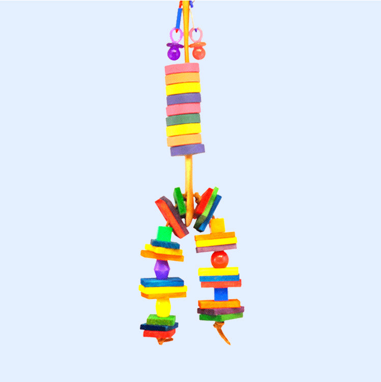 A Wooden Spoon Bird Toy from Squawk Shop with stacked wooden bagels, blocks, and colorful beads, designed to encourage chewing and interactive play for birds.