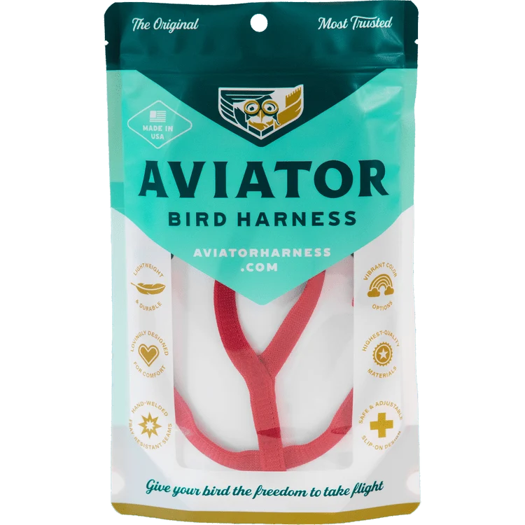 The Aviator bird harness in coral red, in its packet