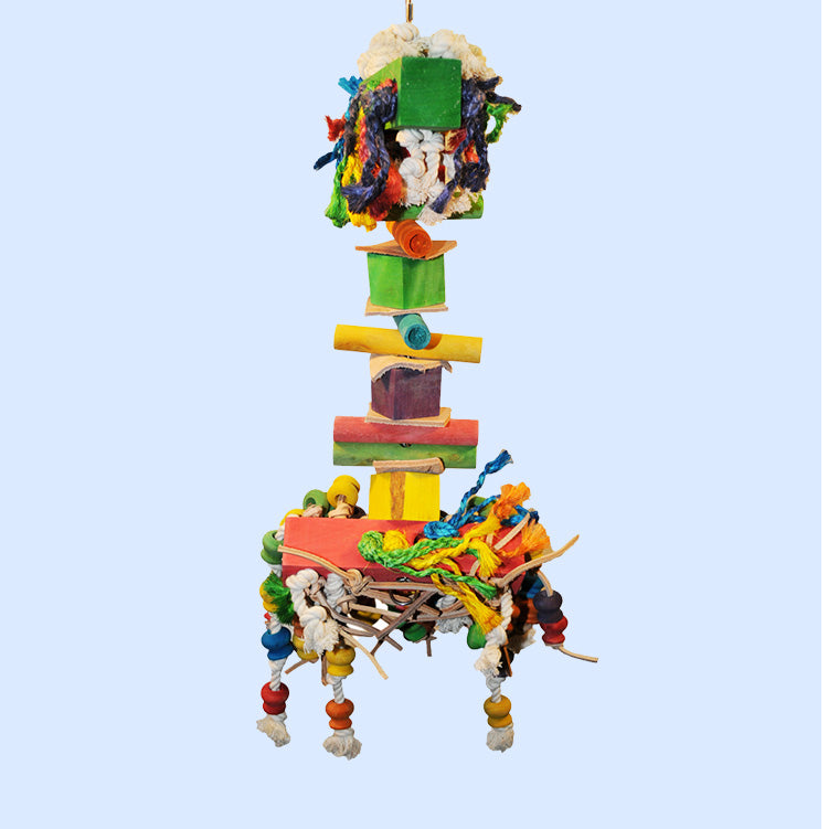 Large Hairy Monster bird toy from Squawk Shop, featuring colorful wooden blocks, knotted ropes, and beads for chewing, climbing, and shredding fun.