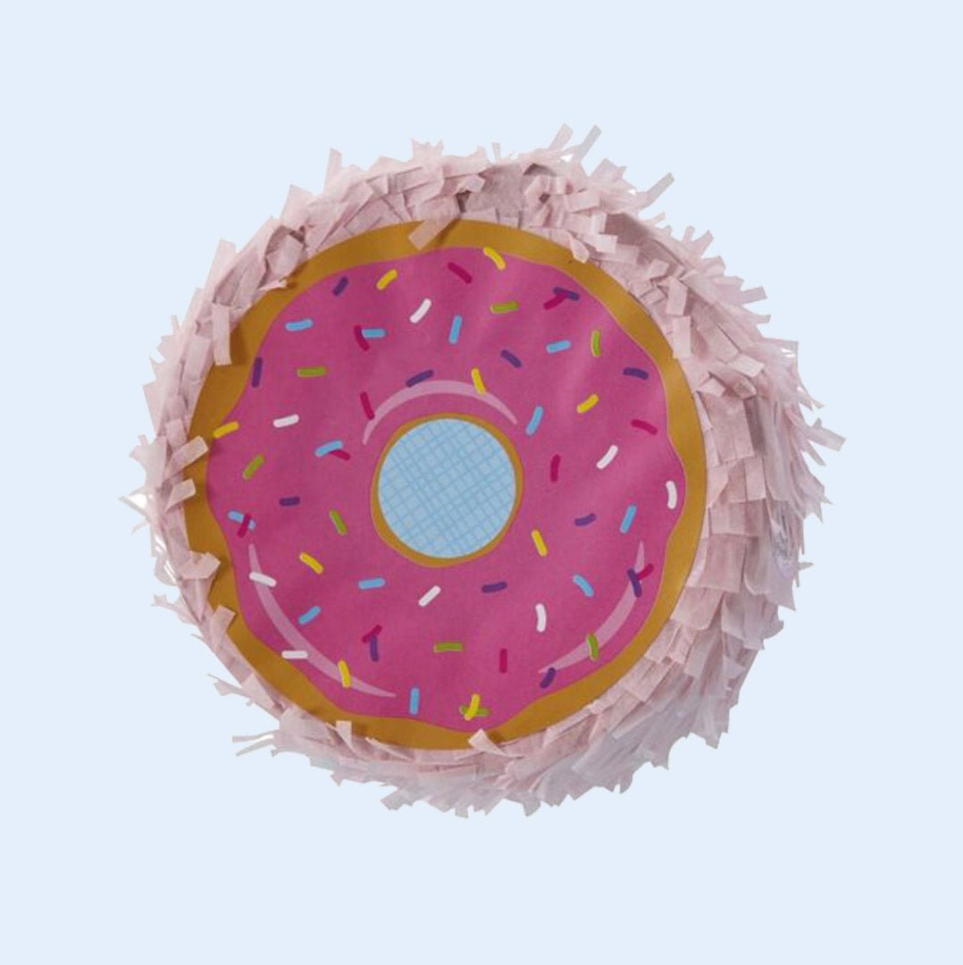 A donut-shaped bird piñata featuring a pink frosted design with colorful sprinkles and a fringe exterior, designed for foraging and shredding fun. Perfect for parrots to explore and enjoy. Available at Squawk Shop.