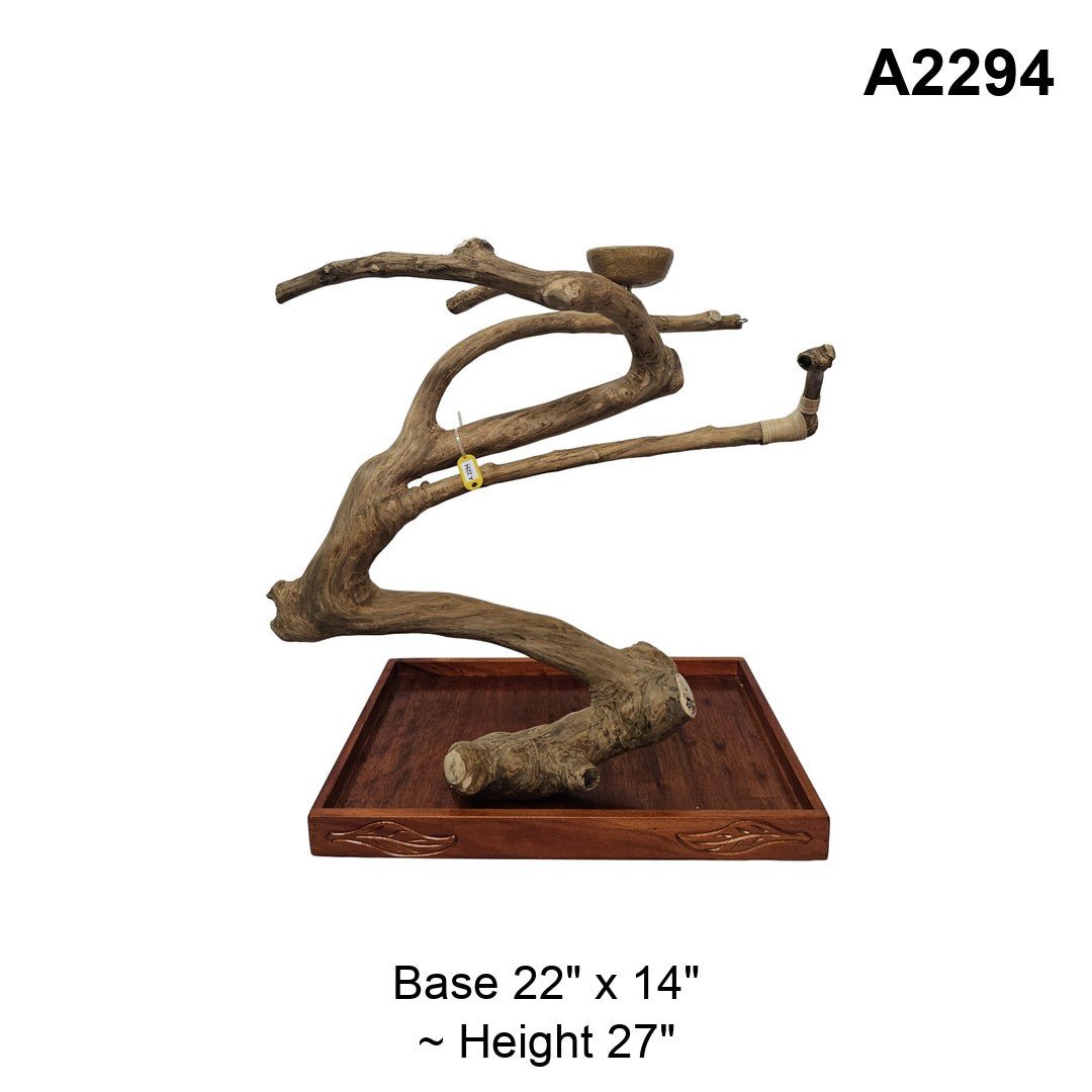 Java wood playstand A2294, thick curved trunk with a bowl on the upper branch, base 22 by 14 inches, about 27 inches tall