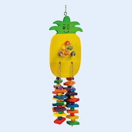 A colorful parrot toy in the shape of a pineapple, featuring a yellow wooden base with green leaves at the top and a cheerful face design. The toy has colorful wooden blocks, beads, and chains hanging below for parrot enrichment and play. Available at Squawk Shop