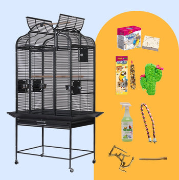 Black parrot cage with open playtop on a rolling stand, shown with the bundle's cactus pinata, perches and treats